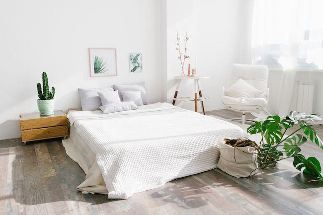 White bedroom with minimal clutter and great light.