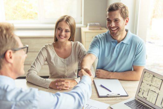 couple negotiating with home seller