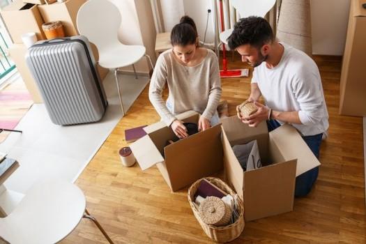 Couple unpacking boxes.