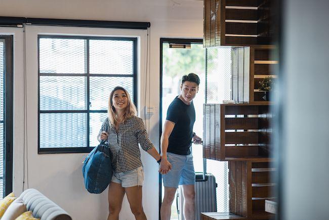 Couple walking into a new home for the first time.