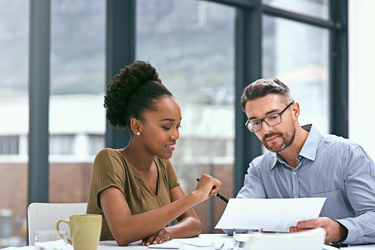 Cropped shot of two colleagues having a meeting in an office